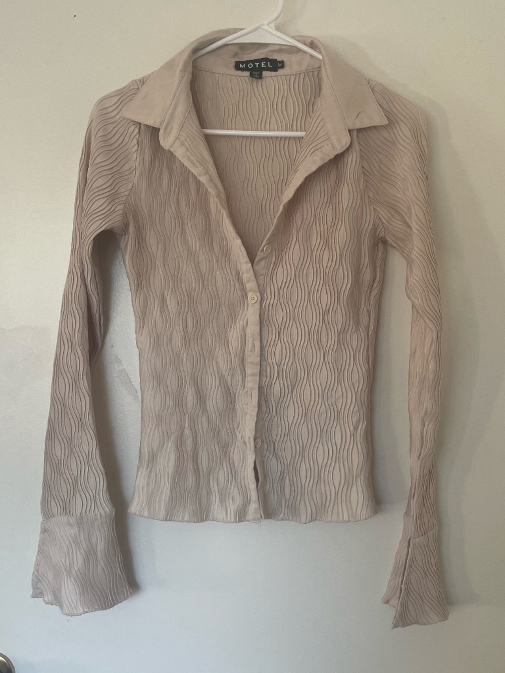 Beige Dress shirt with cute pattern and flared sleeves.